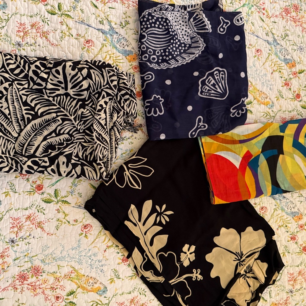 Lot of 4 sarongs. One is fresh from dry cleaner and the rest are never worn.